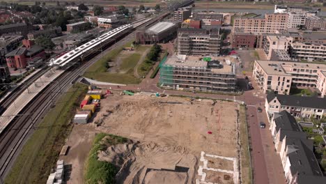 Aerial-descend-and-reveal-of-Noorderhaven-neighbourhood-Ubuntuplein-construction-site-in-urban-development-real-estate-investment-project