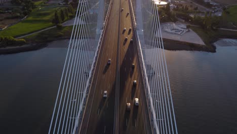 AERIAL-Fly-By-Reveal-Shot-of-Vasco-da-Gama-Bridge-in-Lisbon,-Portugal