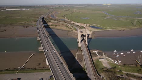 Wide-aerial-drone-view-over-the-Kingsferry-Bridge-and-Sheppney-Crossin-in-Kent-England