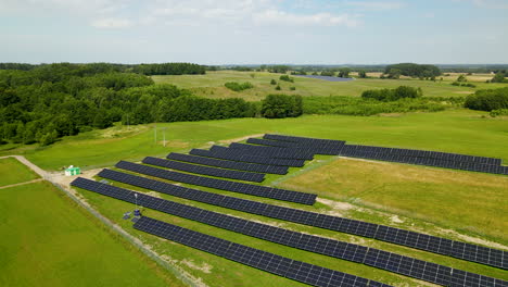 Stunning-aerial-view-of-solar-panels-on-green-field-in-Poland-on-a-sunny-day-copy-space