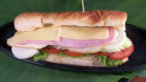 Ham-and-Cheese-Sandwich-with-Healthy-Vegetables-Wrapped-in-a-Break-Roll