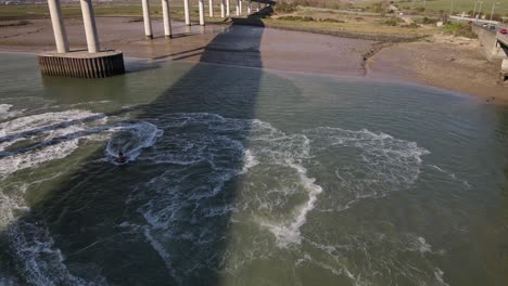 Jet-Skiing-At-The-Swale-Under-Kingsferry-Bridge-And-Sheppey-Crossing-Bridge-In-Kent,-England