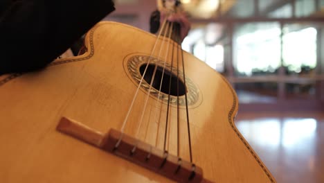 Close-up-of-mariachi-charro-playing-guitar