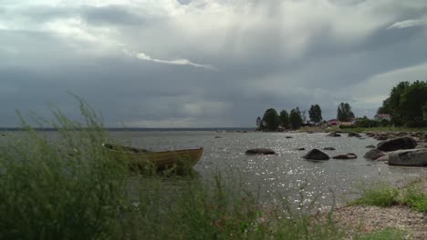 Yellow-boat-moored-in-calm-Käsmu-Bay,-Baltic-Sea,-Estonia
