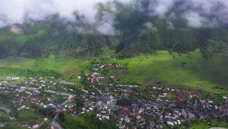 Aerial:-Mestia-highland-town-village-in-Caucasus-Mountains-valley,-Georgia