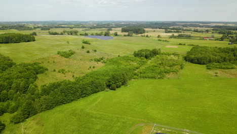 Lush-And-Greenery-Countryside-With-Solar-Panels-At-Summer-In-Northern-Poland