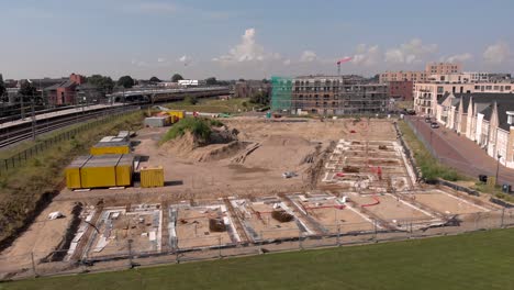 Low-aerial-approach-showing-Noorderhaven-neighbourhood-and-Ubuntuplein-construction-site-in-urban-development-real-estate-investment-project
