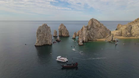 Aerial:-boat-tours-and-liveaboard-at-Arch-of-Cabo-San-Lucas-in-Mexico