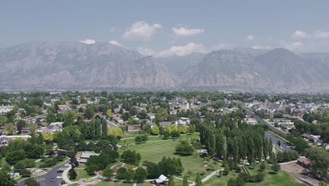 Wasatch-Mountain-Range-in-Background-of-Orem-City,-Utah-County---Aerial