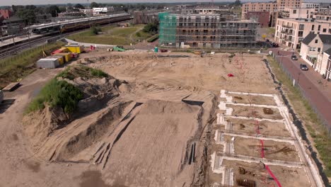 Ascending-aerial-movement-and-reveal-of-Noorderhaven-neighbourhood-Ubuntuplein-construction-site-in-urban-development-real-estate-investment-project