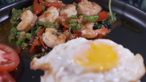 Authentic-Thai-Spicy-shrimp-with-Basil,-Fried-Egg-and-Prawns