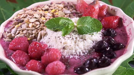 Delicious-smoothie-bowl-in-a-White-Bowl-Filled-with-Raspberries-and-Grains