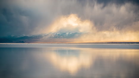 Time-Lapse,-Dark-Clouds-Moving-Above-Salt-Flats-With-Mirror-Reflection-on-Water