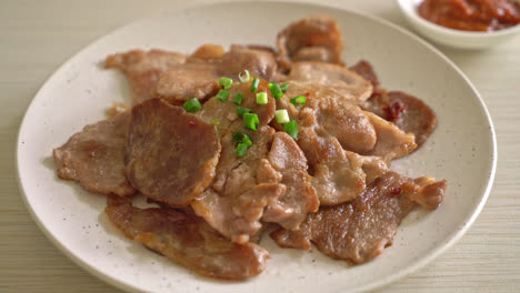 grilled-pork-neck-sliced-on-plate-in-Asian-style