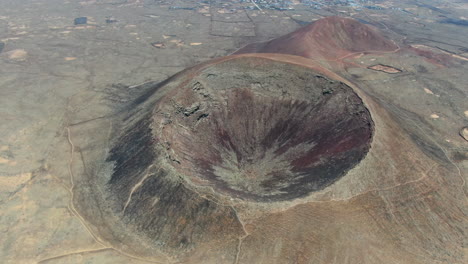 Aerial-drone-panning-shot-over-the-the-Calderón-Hondo-volcano-in-Fuerteventura-island