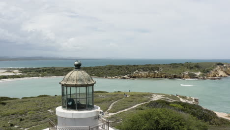 Crane-up-aerial-shot-past-the-gallery-and-lantern-panes-on-the-Faro-Los-Morrillos-lighthouse-in-Cabo-Rojo-Puerto-Rico