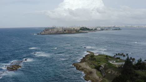 Smooth-aerial-pullout-shot-over-Isla-de-Cabra-Puerto-Rico---A-former-leper-colony-now-a-recreation-area