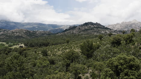 Low-level-drone-aerial-over-the-epic-and-cinematic-mountain-ranges-of-Sierra-De-Guadarrama-in-the-Parque-Nacional-del-La-Pedriza-Spain