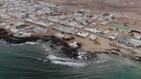 Aerial-view-of-ocean-waves-on-coastline-of-La-Graciosa,-Canary-islands,-Spain