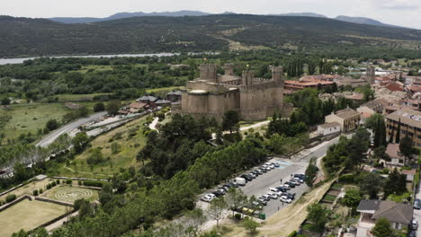 Point-of-interest-aerial-over-the-town-of-Manzanares-el-Real-with-the-Mendoza-Castle-in-centre-frame