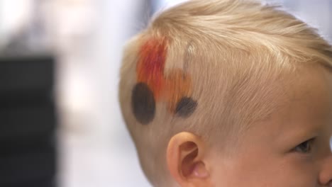 Young-Boy-Having-Color-In-Hair,-Styling-At-Hair-Saloon,-Close-Up