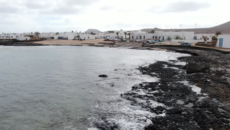Low-altitude-drone-footage-of-La-Graciosa-harbour-near-island-of-Lanzarote