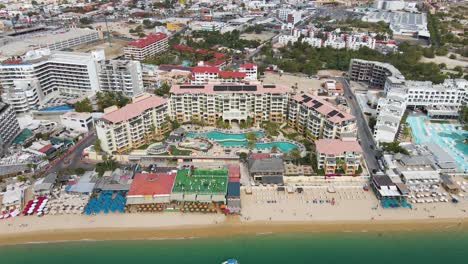 Aerial:-Cabo-San-Lucas-beachfront-hotels-in-Mexico,-Baja-California-Sur
