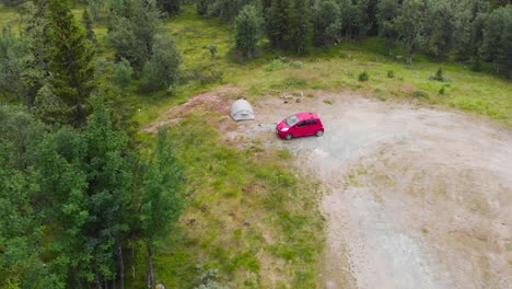 Red-Car-And-A-Tent-In-A-Camping-Ground-With-Vegetation-In-Sweden