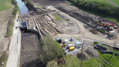 Aerial-flight-over-new-constructions-site-on-a-canal-lock-development-in-the-north-of-England