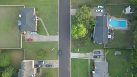 Top-down-view-of-suburban-street-and-homes