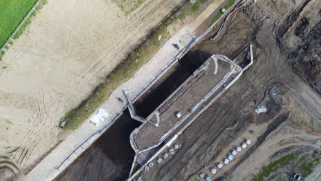 Aerial-flight-over-constructions-site-maintaining-an-old-canal-lock
