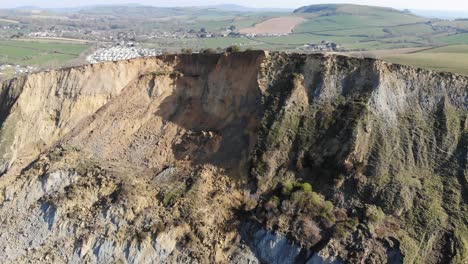 Aerial-Over-Massive-Cliff-Fall-Debris-Into-English-Channel-At-Seatown-In-Dorset