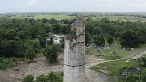 Aerial-close-up-of-the-chimney-stack-at-an-old-abandoned-factory-in-Puerto-Rico