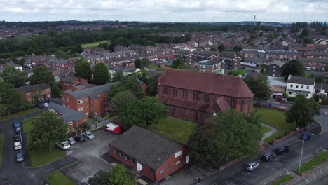 Suburban-Neighbourhood-residential-British-housing-estate-homes-aerial-view-pan-right