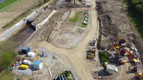 Aerial-flight-over-new-constructions-site-on-a-canal-lock-development-in-the-north-of-the-UK