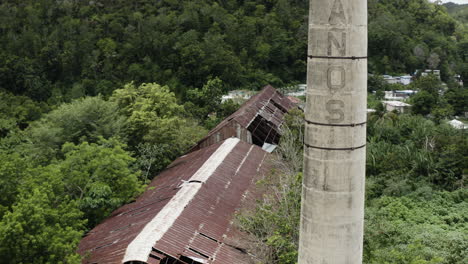 The-old-chimney-stack-and-collapsing-rooftops-of-a-long-abandoned-warehouse-in-Puerto-Rico