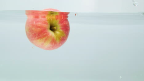 Red-Apple-Falling-In-Water