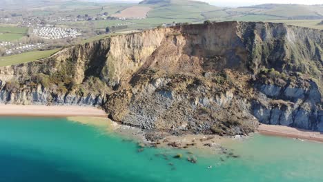 Aerial-Parallax-View-Of-Massive-Jurassic-Coast-Cliff-Fall-At-Seatown-In-Dorset