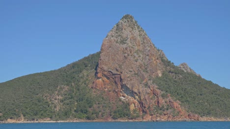 Rocky-Peak-Of-Pentecost-Island-Against-Blue-Sky---Scenic-Island-With-Seascape-In-Whitsunday,-QLD,-Australia