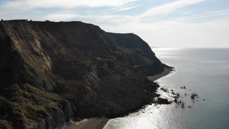 Aerial-Side-View-Of-Massive-Jurassic-Coast-Cliff-Fall-At-Seatown-In-Dorset