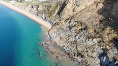 Aerial-Over-Massive-Rockfall-Debris-Into-English-Channel-At-Seatown-In-Dorset