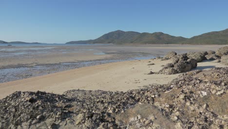 Muddy-Landscape-During-Low-Tide-In-Shaw-Island-Near-The-Burning-Point-In-Whitsundays,-Queensland,-Australia