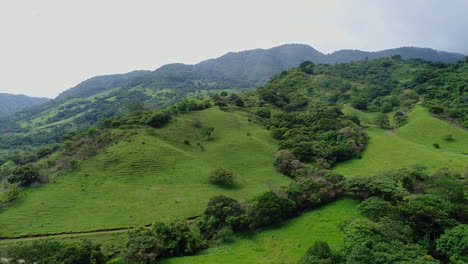 Rising-aerial-in-rural-mountain-region-costa-rica-with-birds-flying-overhead,-4K