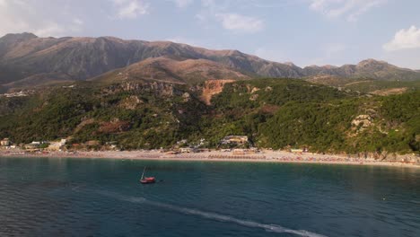 Beautiful-coastline-of-Southern-Albania-with-blue-sea,-sandy-beaches-and-mountains
