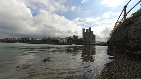Timelapse-historic-Caernarfon-castle-Welsh-medieval-harbour-waterfront-town-landmark