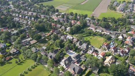 Aerial-of-beautiful-wealthy-neighborhood-at-the-edge-of-a-small-town