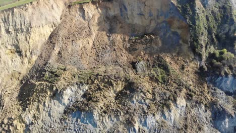 Aerial-backward-shot-showing-the-huge-cliff-fall-at-seatown-in-Dorset-England