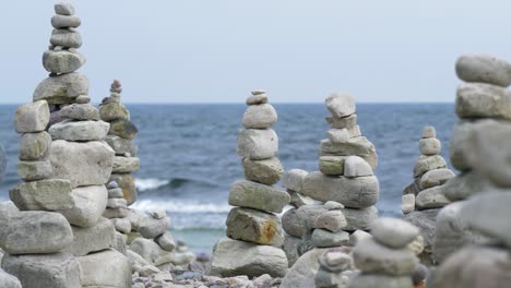 Relaxing-view-of-piled-stones-next-to-the-ocean,-loopable-clip