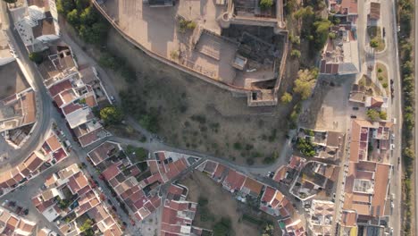 Vertical-aerial-top-down-view-revealing-Castro-Marim-castle-and-surrounded-parish-village