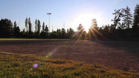 Bright-sun-shines-on-beautiful-empty-baseball-field-park